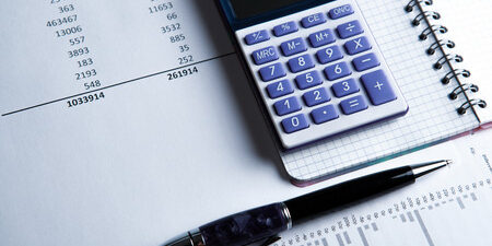31215430-work-on-the-calculator-and-papers-close-up